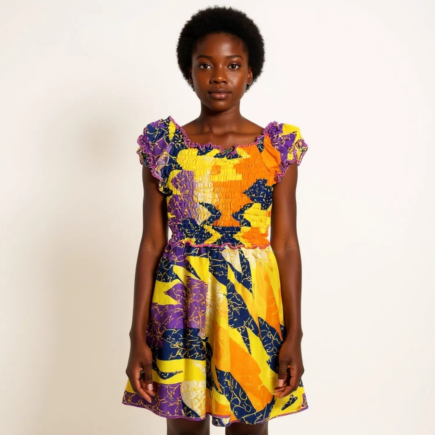 Robe africaine en wax et en coton coloré smocké