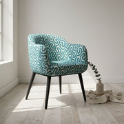 Chaise design moderne turquoise et blanc, confortable, pieds noirs robustes