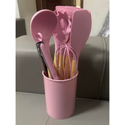 Ustensiles de cuisine en silicone rose et vert clair, set design et résistant