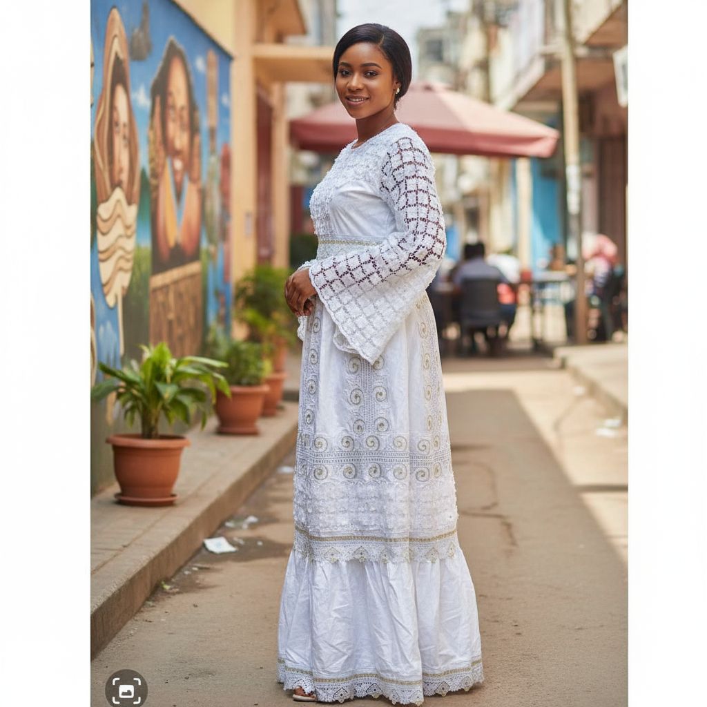 Robe blanche mariage femme longue dentelle dorée Geztner élégante cérémonie